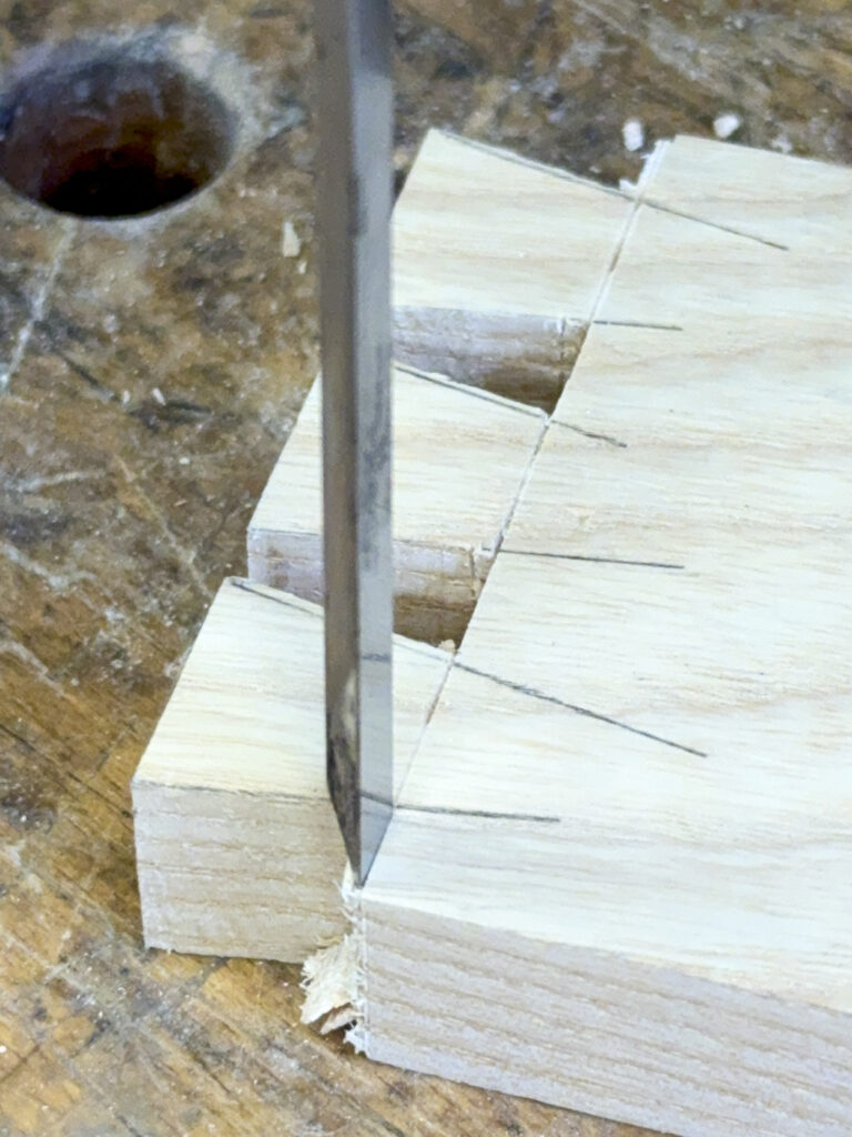 chiseling the ends of the dovetail base line