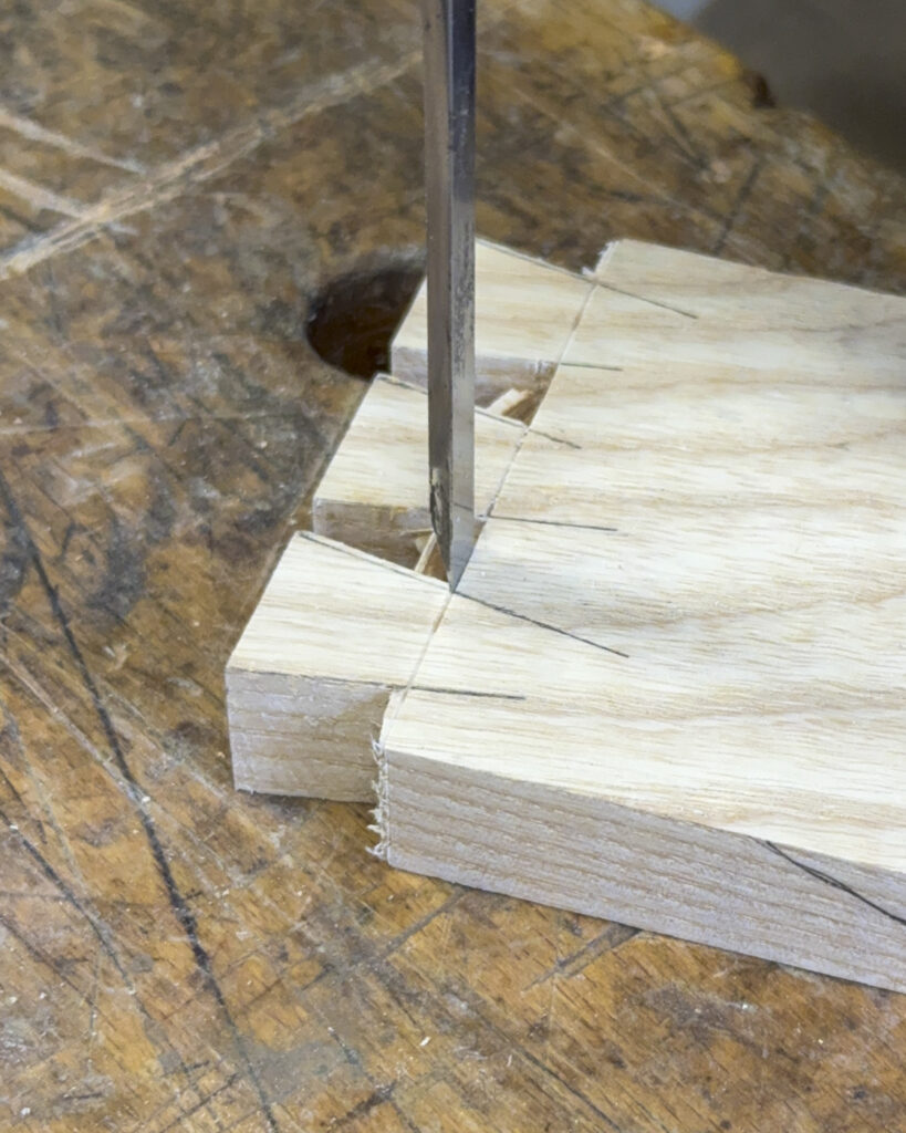 positioning the chisel on the dovetail base line